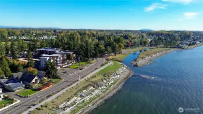 From the Bay, a view of the beach and grass field shown here owned by Grand Bay right at the mouth of Terrelll Creek shown here along Birch bay drive.