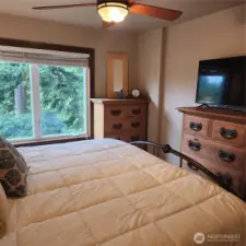 Up in the trees, feel like a tree fort! Ceiling fan in the primary bedroom.