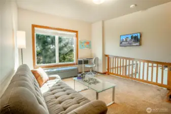 The open loft shown with the TV screen.