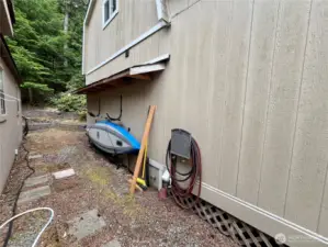 Storage on the side of the outbuilding
