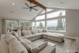 Vaulted ceilings and soft neutral tones enhance the airy atmosphere for a grand feel.
