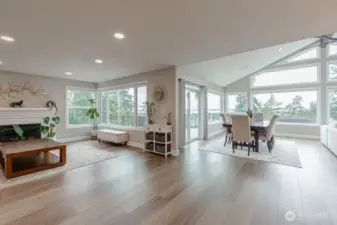 The living room is open to the dining room and family room for easy flow gatherings.