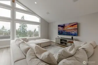 Spacious family room summons relaxation.