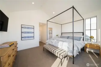 The Primary Suite: Four Seasons® mattress, designer furniture, and newly installed drapery (not shown).