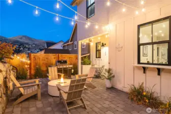 Propane fire-pit by Room & Board®, Serena and Lilly® hanging basket swing, serving counter with quartz counter top, outdoor Sonos® speaker and more.