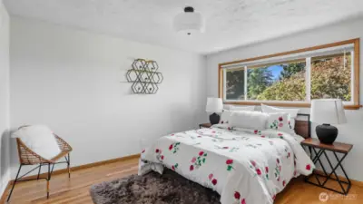 retreat to this beautiful primary suite, bathed in natural light.