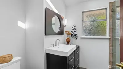 reshly updated 3/4 bath offering both function and style.