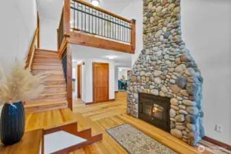 Entrance with vaulted ceilings and a loft overlooking the front door
