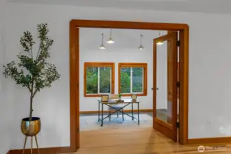 View from dining area side into the multi-purpose extra room.