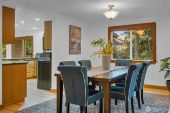 Dining room with the kitchen to the left. Overlooks the side and back garden and has plenty of light coming in!