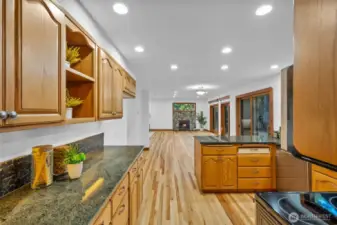 Walking from the dining room into kitchen and great room in distance. FULL plans for kitchen remodel available and in home to view.