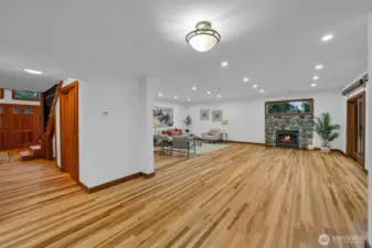 Down this hall is the main entrance. Down this hall to the left is the half bath and the doors you see to the right is to the pantry