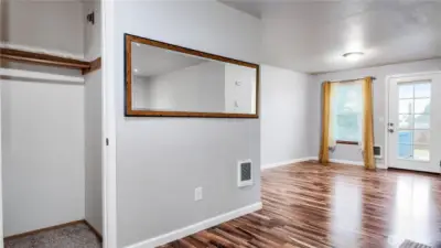 Functional transition space with closet storage and open flow into the main living area.
