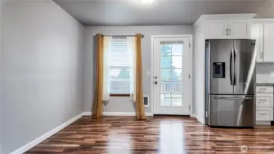 Dining area with backyard access offering great natural light and easy indoor outdoor living.