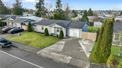 Front exterior aerial view featuring driveway, front yard, and single-level home layout.