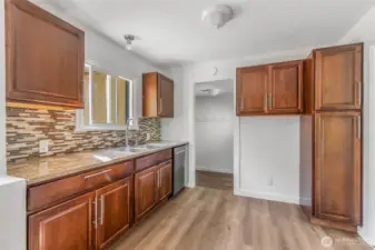 Another door leads from kitchen to 3 additional bedrooms