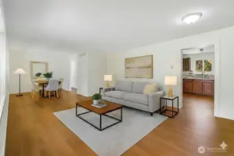 Living and dining room. The image has virtual AI generated staging