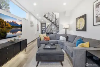 Light-filled open-concept living space with wide-plank flooring, modern finishes, and seamless flow ideal for everyday living and entertaining.