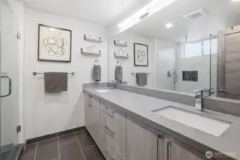 Spa-inspired bathroom with double vanity, modern fixtures, and large walk-in shower.