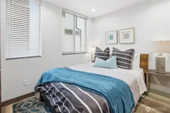 Bedroom 1 on second level, contains custom blinds and custom closet system.