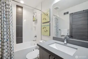 Full bath complete with deep soaking tub on second level is shared by the 2 bedrooms on this level.