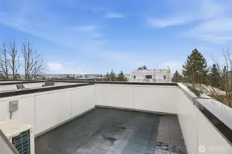 The rooftop deck awaits for breathtaking sunsets and water views.