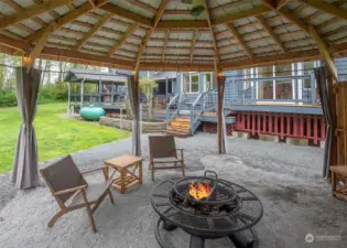 Gazebo and firepit stay with the property.