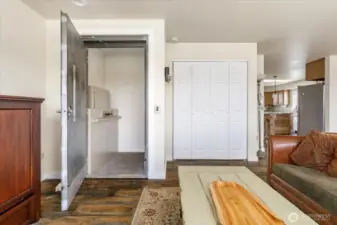 Elevator door in living room connects to garage level.