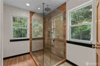 Luxury two-person temperature control, multi-head shower with full glass surround and heated floors