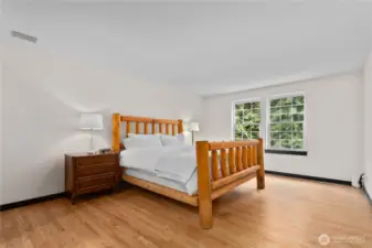 Quiet primary suite easily fits a California King