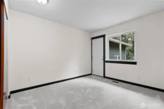 Another secondary bedroom or home office (door leads to small deck and theatre room)