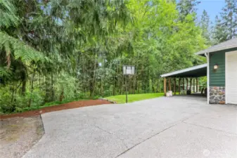 Massive carport offers 2+ additional covered parking spaces