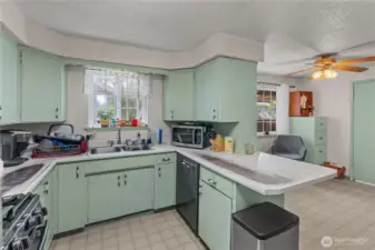 Kitchen with dining area in the background