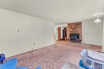 Living room--open entry to the left of the brick leads to the large other living area