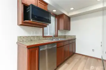 stone tile countertops, new flooring and brand new refrigerator, oven and dishwasher