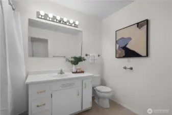 Full bath with tub/shower combo.