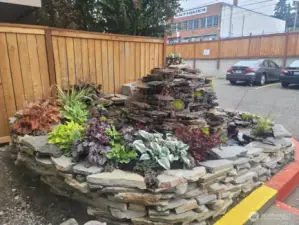 The soothing sounds of cascading water fills the air by the 2nd entrance