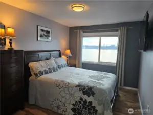 The bedrooms are very spacious with a queen size bed, highboy dresser, night stands, wall mounted TV and a large closet with an extra set of sheets, hangers and laundry basket.