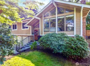 Beautiful light filled home with large windows and private yard