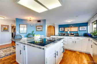 Behind the wall, you'll see that this owner designed an extended pantry featuring custom shelving and an additional refrigerator.