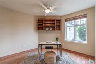 Study/Den or Bonus room located off of carpeted living space. Window has view of backyard.