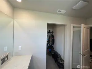 Primary's walk-in closet from bathroom