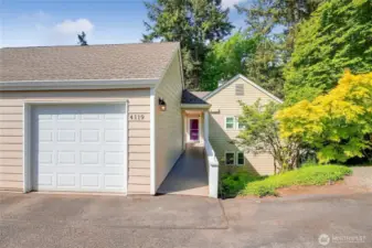 1-car x-large garage with overhead storage.   Picture taking in Spring. Enjoy all the seasons in this end unit condo.