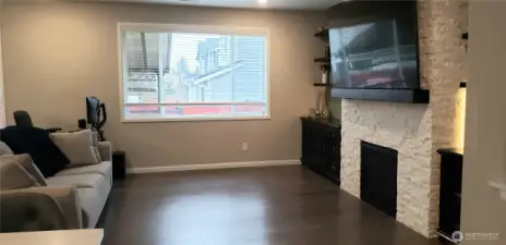 A Picture of the Spacious Living Room Showing the Gorgeous Brick Gas Fireplace.