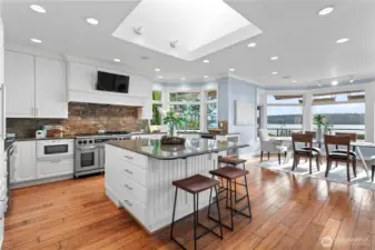 The chef’s kitchen is a masterpiece of design  and functionality. Equipped with high-end  appliances, custom cabinetry, and a spacious  island, it’s an ideal space for culinary  creativity and social gatherings.