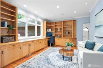 Experience productivity and style in this  beautifully appointed home office, featuring  custom built-in cabinetry that blends form  and function. The elegant cabinetry provides  ample storage and organization for books,  documents, and office essentials, creating a  clutter-free and efficient workspace.