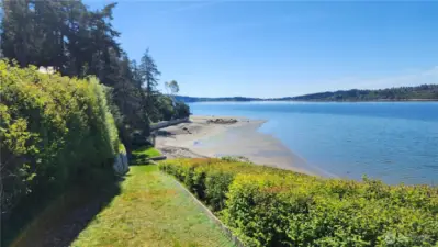 You have your own waterfront lawn for those  special moments that you can only get on  your private waterfront. This could all be  yours—a special place on a private 7-acre  wooded wonderland with fantastic views of  the Puget Sound and Olympic Mountains,  along with your own private beach.
