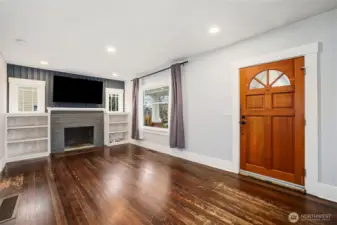 Living room with Fir floors  non working fireplace.