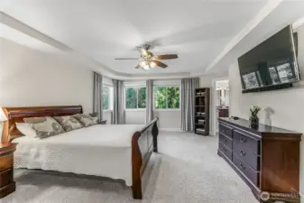 Sumptuous Primary Suite with tranquil view.