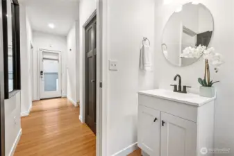 Main floor guest bath (entry door down the hall)